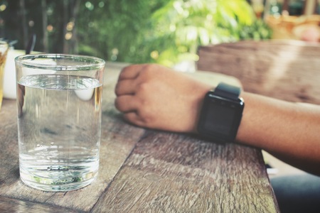 Drink water with smart watchの写真素材