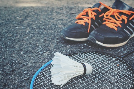 Set sports of sport shoes and shuttlecocks with badminton racket.の写真素材