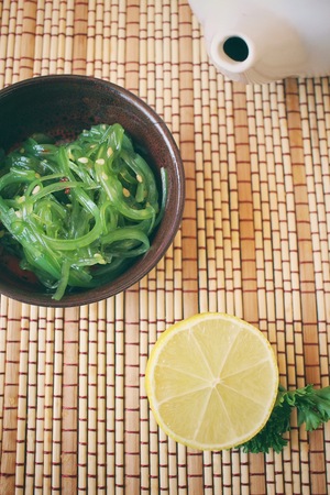 Seaweed salad with hot teaの写真素材