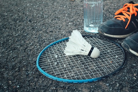 Set sports of sport shoes and shuttlecocks with badminton racket.の写真素材