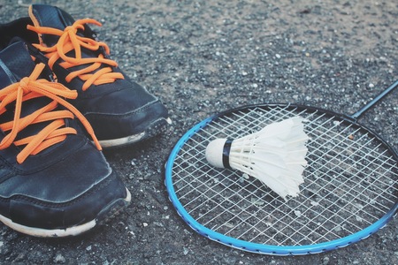 Set sports of sport shoes and shuttlecocks with badminton racket.の写真素材