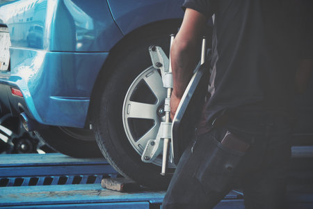 wheel alignment at repair service station - vintage style