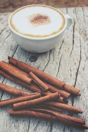 Cappuccino coffee with cinnamon sticksの写真素材