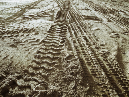 Wheel tracks on the soil.