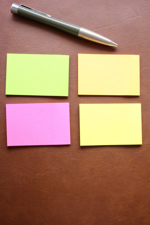Stick note with pen on office table