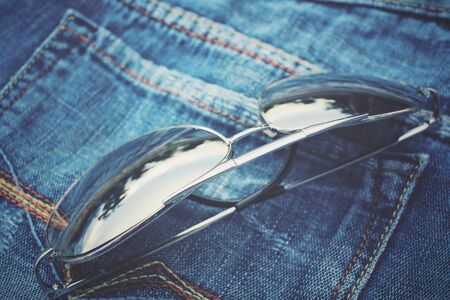 Glasses with jeans pocketの写真素材