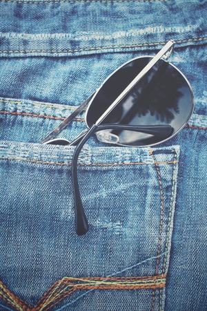 Glasses in jeans pocketの写真素材
