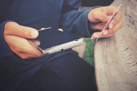 Woman buying online and card with smart phone.の写真素材