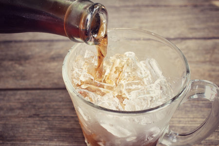 Cola with ice cubes