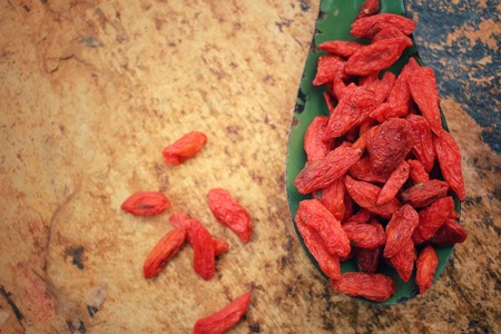 Dried goji berries on vintage spoonの写真素材