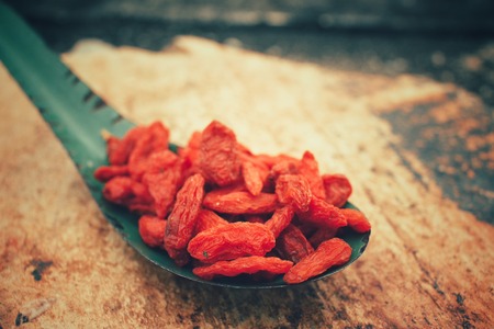 Dried goji berries on vintage spoonの写真素材