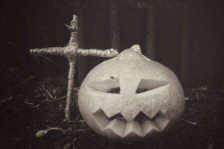 Halloween pumpkin with crossの写真素材