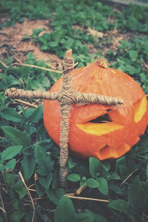 Halloween pumpkin with crossの写真素材