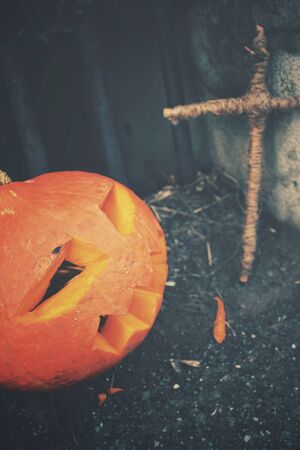 Halloween pumpkin with crossの写真素材