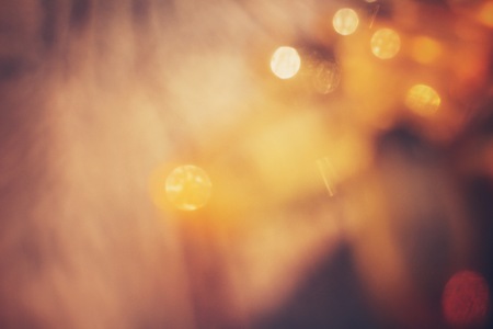 Gold bokeh on black backgroundの写真素材