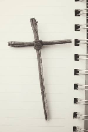 Blank notepad with crossの写真素材