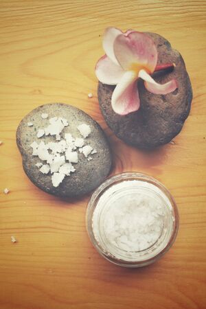 Spa set of stones and salt with flowerの写真素材
