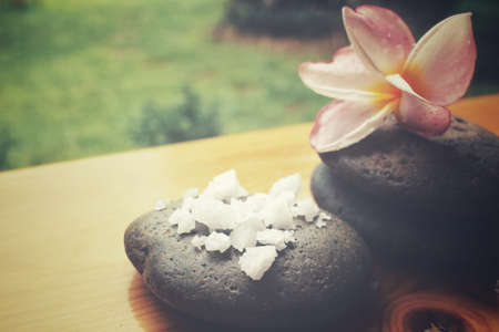 Spa set of stones and salt with flowerの写真素材