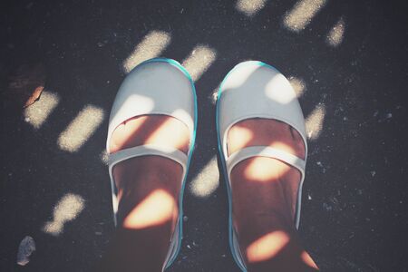 Selfie of shoes with shadowの写真素材