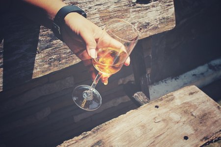 Glasses of brandy on handの写真素材