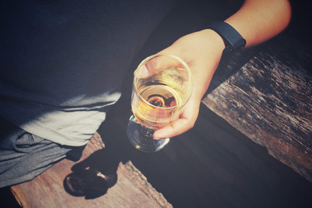 Glasses of brandy on hand