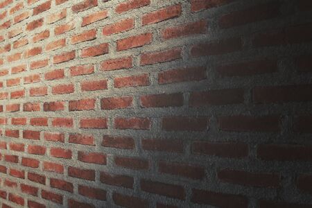 Brick wall with shadowの写真素材