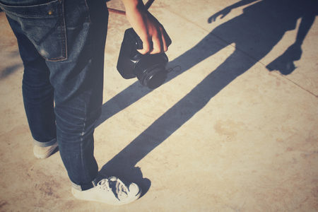 Using a camera to take photo with shadowの写真素材