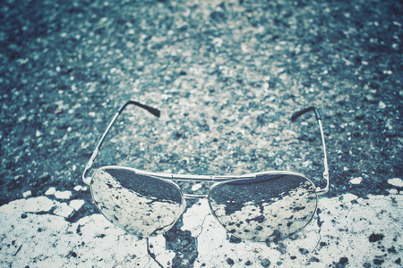 Sun glasses with reflection and roadの写真素材