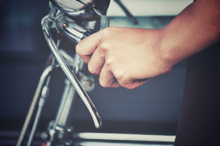 Hand with bicycleの写真素材