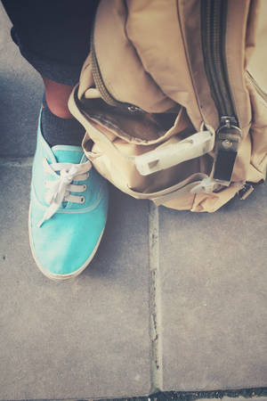 Selfie of woman tourist with a backpack standing on roadの写真素材