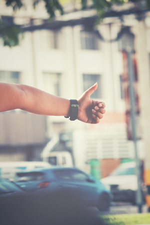 Woman hitchhiking on the roadの写真素材