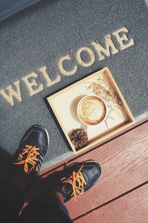 Selfie of latte coffee with dried flowersの写真素材