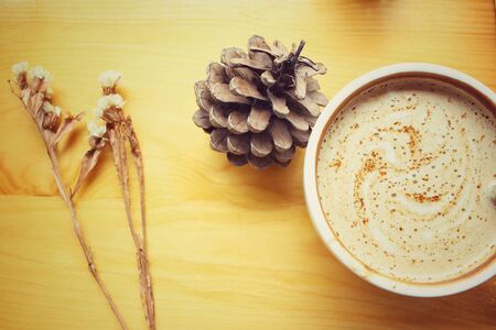 Vintage latte coffee with dried flowersの写真素材