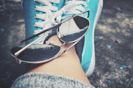 Sneakers with sun glassesの写真素材
