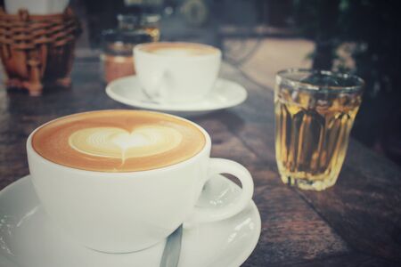 Vintage latte art coffeeの写真素材