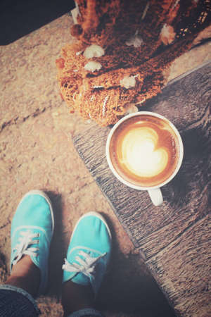 Selfie of sneakers with coffee cupの写真素材