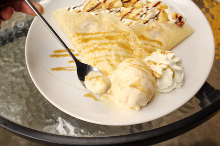 Crepes with banana and ice creamの写真素材