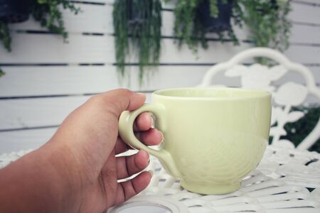 Selfie of hand with hot coffeeの写真素材