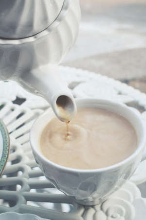 Hot tea with milkの写真素材