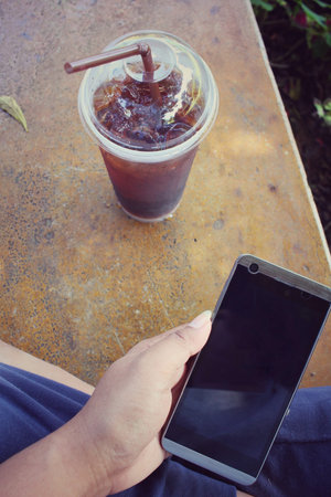 Selfie of iced coffee with smart phone
