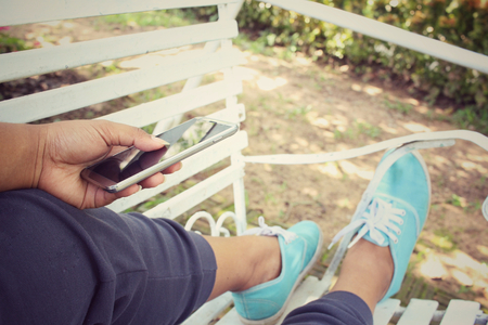 Selfie of smart phone on benchの写真素材