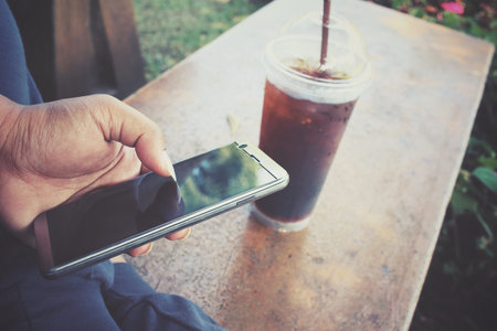 Selfie of iced coffee with smart phone
