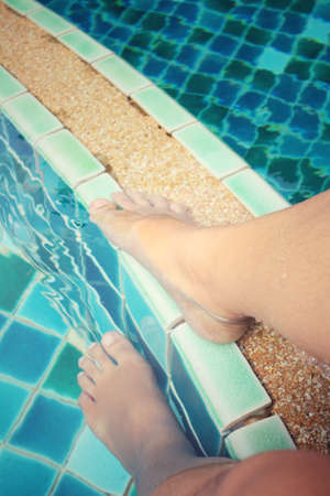 Selfie of feet with poolの写真素材
