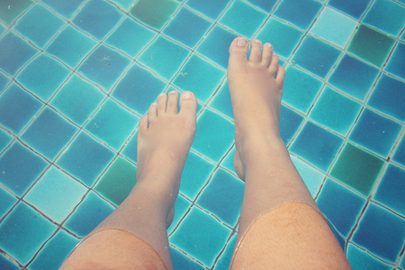 Selfie of feet with poolの写真素材