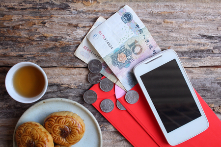 Red envelope with festival moon cake in chinese new year festivalの写真素材