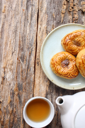 Festival moon cake with hot tea - Chinese cakeの写真素材
