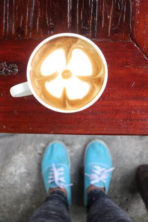 Selfie of coffee with shoesの写真素材