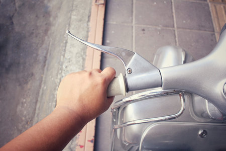 Selfie of vintage motorcycle with handの写真素材