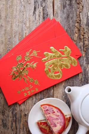 Chinese dessert with red envelope in chinese new year festival