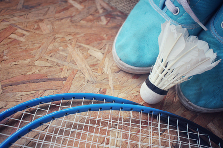 Sneakers with shuttlecocks and badminton racket.の写真素材